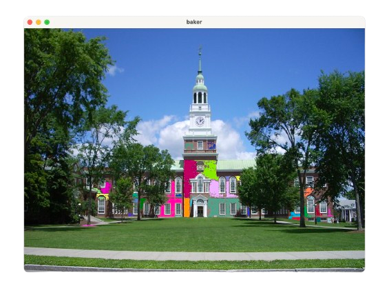 Flood-fill region detection on Baker Library. Regions of roughly brick-colored pixels are recolored at random, so each color block is one connected component the region grower found.